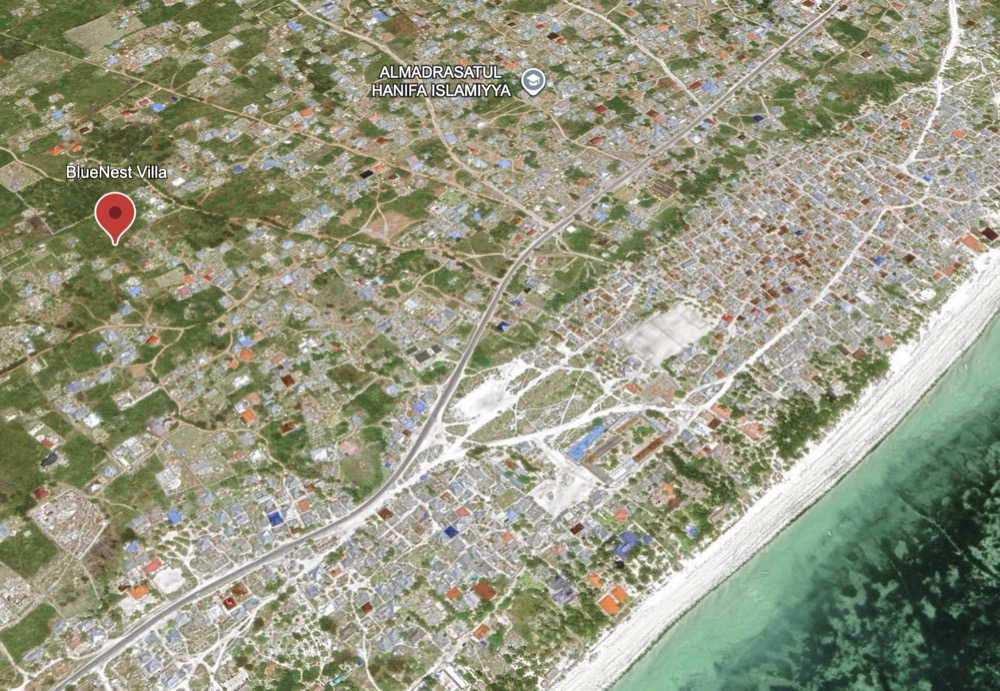 Aerial view of Bwejuu with BlueNest Villa marked near the coast